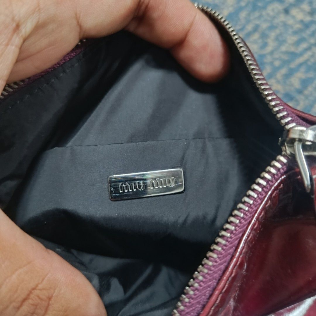 Miu Miu Red Patent Leather Handbag (Category: Luxury Bags & Wallets) located in Angeles City. Submitted by thriftilious.ph (Listing ID 1425218721, Image 3). Description: miu Miu patent leather handbag burgundy, in excellent condition issue check last pics .