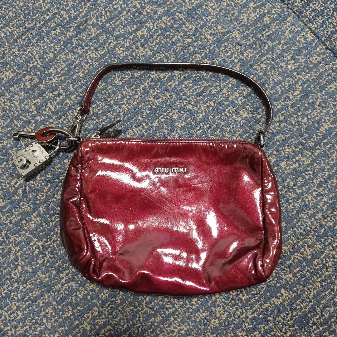 Miu Miu Red Patent Leather Handbag (Category: Luxury Bags & Wallets) located in Angeles City. Submitted by thriftilious.ph (Listing ID 1425218721, Image 1). Description: miu Miu patent leather handbag burgundy, in excellent condition issue check last pics .