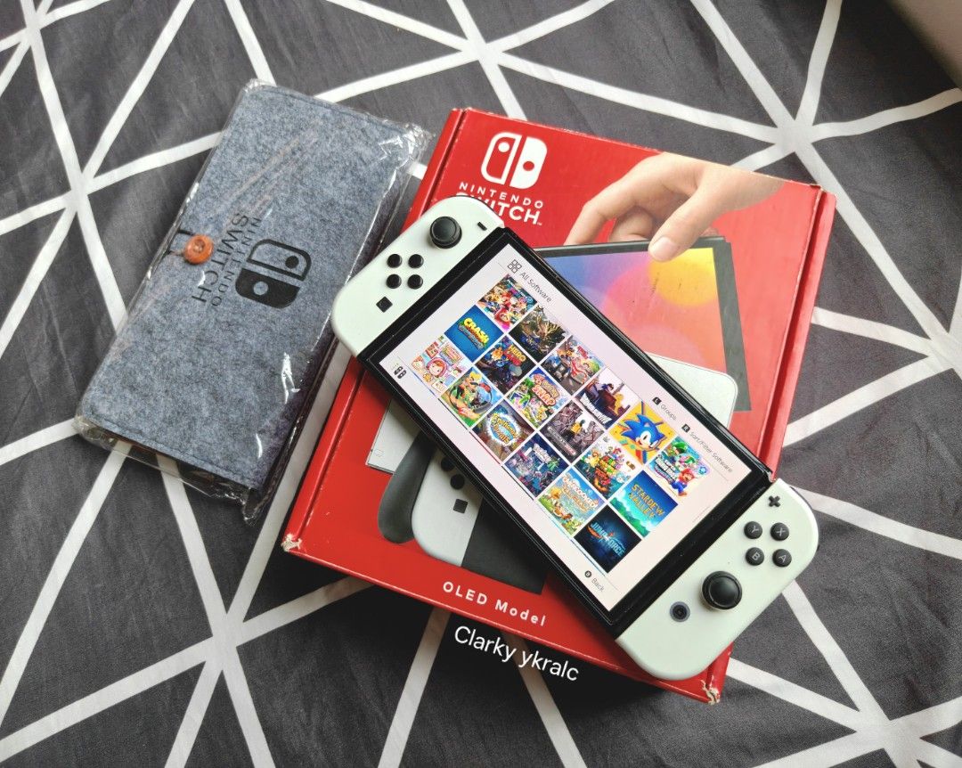 Nintendo Switch Oled White with Free Games (Category: Nintendo) located in Manila. Submitted by nswitchgear (Listing ID 1425124436, Image 2). Description: Nintendo Switch OLED with Free Games ₱10,999 FREE acess to my Paid games Legit purchase not Jailbreak. Used item but in Good/Best condition Can give 7 Days personal Warranty for peace of mind. -Doon po tayo sa kaya tayong issupport, dont settle for less. Comes w/ Complete Package w/ pouch (Box,