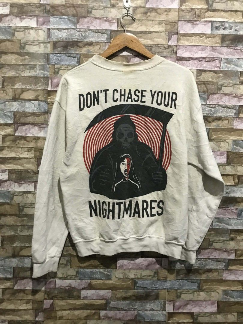 Pierce The Veil Graphic Sweatshirt (Category: Coats, Jackets and Outerwear) located in Cavite. Submitted by goofyasschigga (Listing ID 1425202999, Image 2). Description: Sweatshirt features a Pierce The Veil logo on the front and a graphic on the back that says "Don't Chase Your Nightmares". It is a crew neck style. The sweatshirt is white..