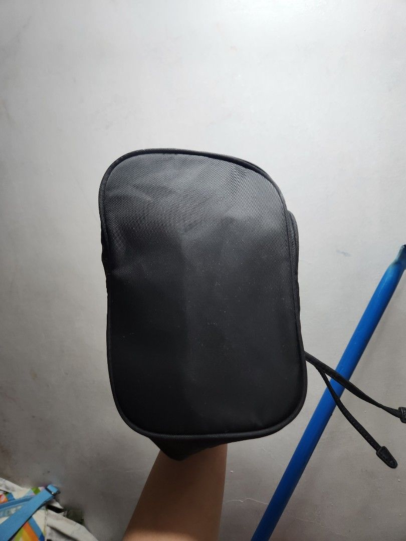 Prada Black Bag (Category: Luxury Bags & Wallets) located in Manila. Submitted by jialyn03310_tree (Listing ID 1425082028, Image 3). Description: Black Prada bag with gold-toned hardware. Features a drawstring closure and a zipper closure. The bag has a Prada Milano logo on the front. The interior has a Prada logo. Includes a detachable strap. Made in Italy. for pouch use only ,pero andito pa lahat ng natangal na part.