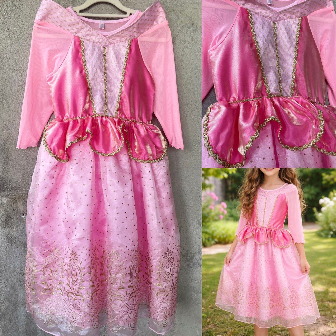 Princess Aurora Costume 7-9 y.old (Category: Babies & Kids Fashion) located in Taguig. Submitted by gzcollections (Listing ID 1425107675, Image 1). Description: Beautiful pink dress is perfect for any little princess! It features long sleeves, a layered bodice with gold trim, and a flowing skirt with gold detailing. The dress is designed to resemble Princess Aurora's iconic gown. It's ideal for dress-up, parties, or imaginative play. The dress is