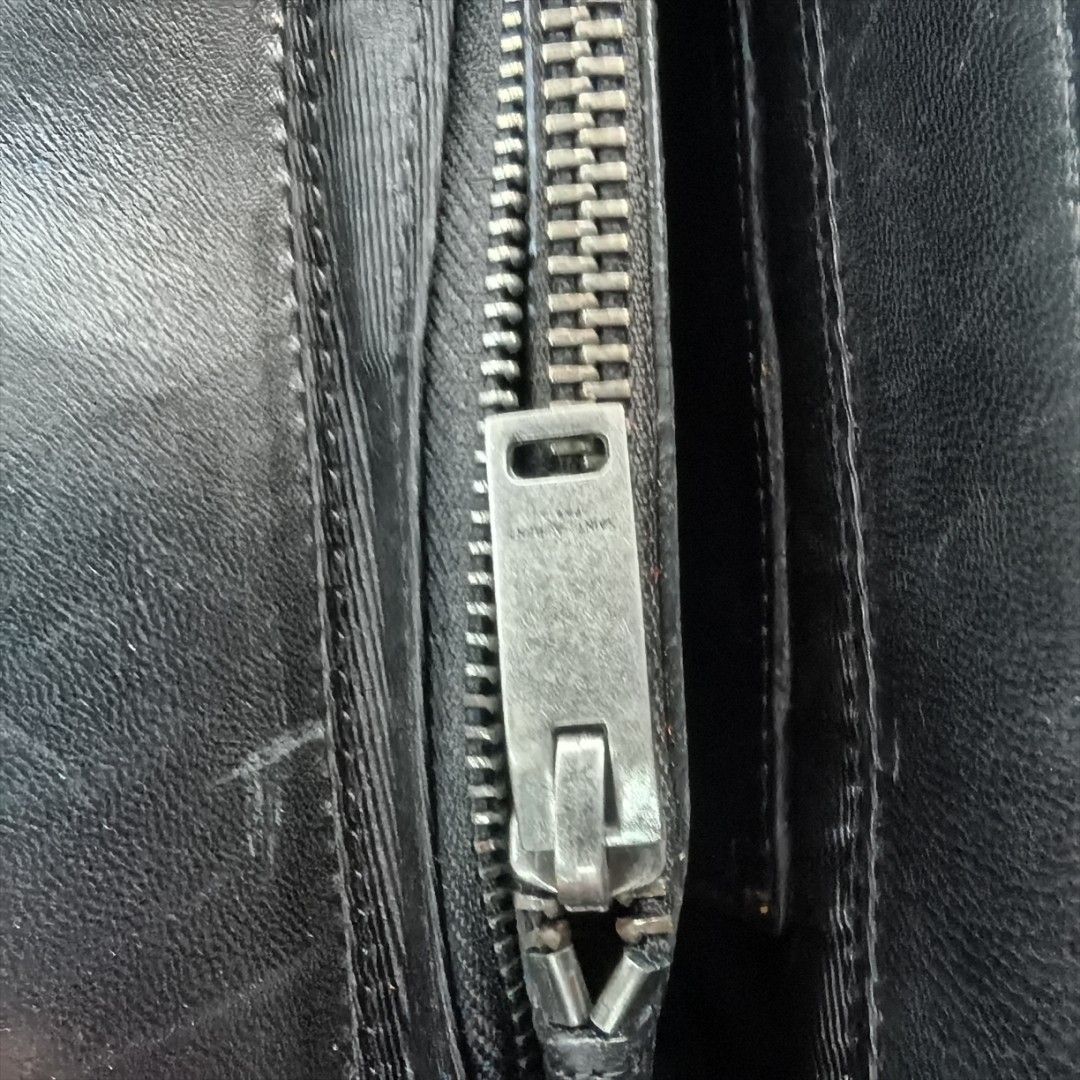 Saint Laurent LouLou Small Shoulder Bag (Category: Luxury Bags & Wallets) located in Buenavista. Submitted by b.side_fleamart (Listing ID 1425205318, Image 3). Description: Black Saint Laurent LouLou Small shoulder bag. Features a quilted design, silver-tone hardware, and a chain shoulder strap. The interior includes a zip pocket and a Saint Laurent Paris label. The bag has a magnetic snap closure. Made in Italy. Serial number SB2737-027412..