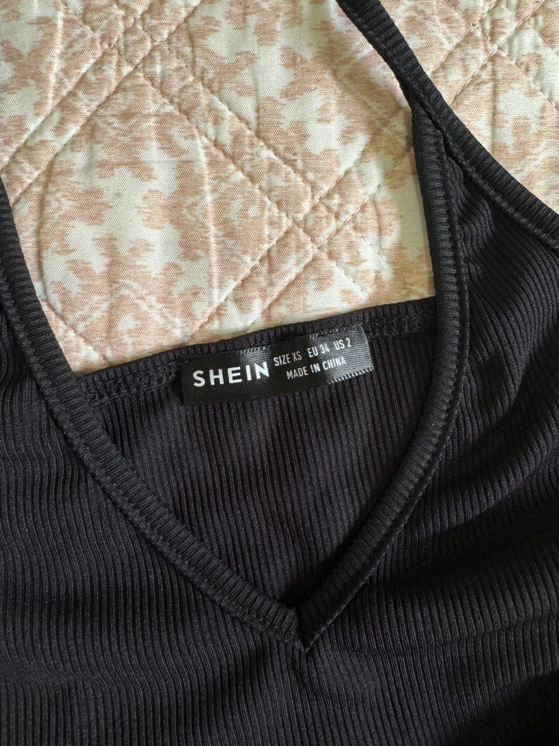 SHEIN Black Halter Bodysuit XS (Category: Others Tops) located in Manila. Submitted by andreaaarut2 (Listing ID 1425155400, Image 2). Description: - SHEIN Black Halter Bodysuit - Size: XS - Features a flattering halter neck design - Classic black color - Perfect for various outfits.
