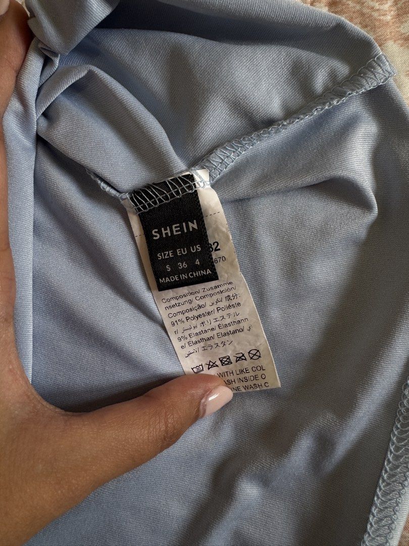 Shein Tube Top - Size S (Category: Others Tops) located in Manila. Submitted by andreaaarut2 (Listing ID 1425155393, Image 2). Description: - Shein tube top - Size S - Light blue color - Soft material - Perfect for casual wear.