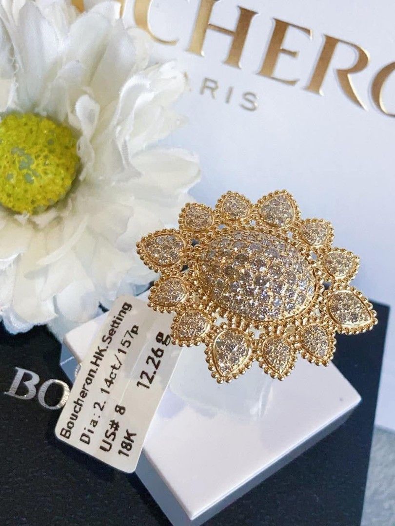 Size 8 Bchrn 18K Gold HK Setting Diamond Ring (Category: Rings) located in Manila. Submitted by primejewelry (Listing ID 1425244581, Image 2). Description: Exquisite Boucheron ring featuring a unique sunflower design. It is set with diamonds and crafted in 18K gold. The ring size is US 8. The tag indicates a diamond weight of 2.14ct/157p and a weight of 12.26g. A beautiful piece for any jewelry collection..