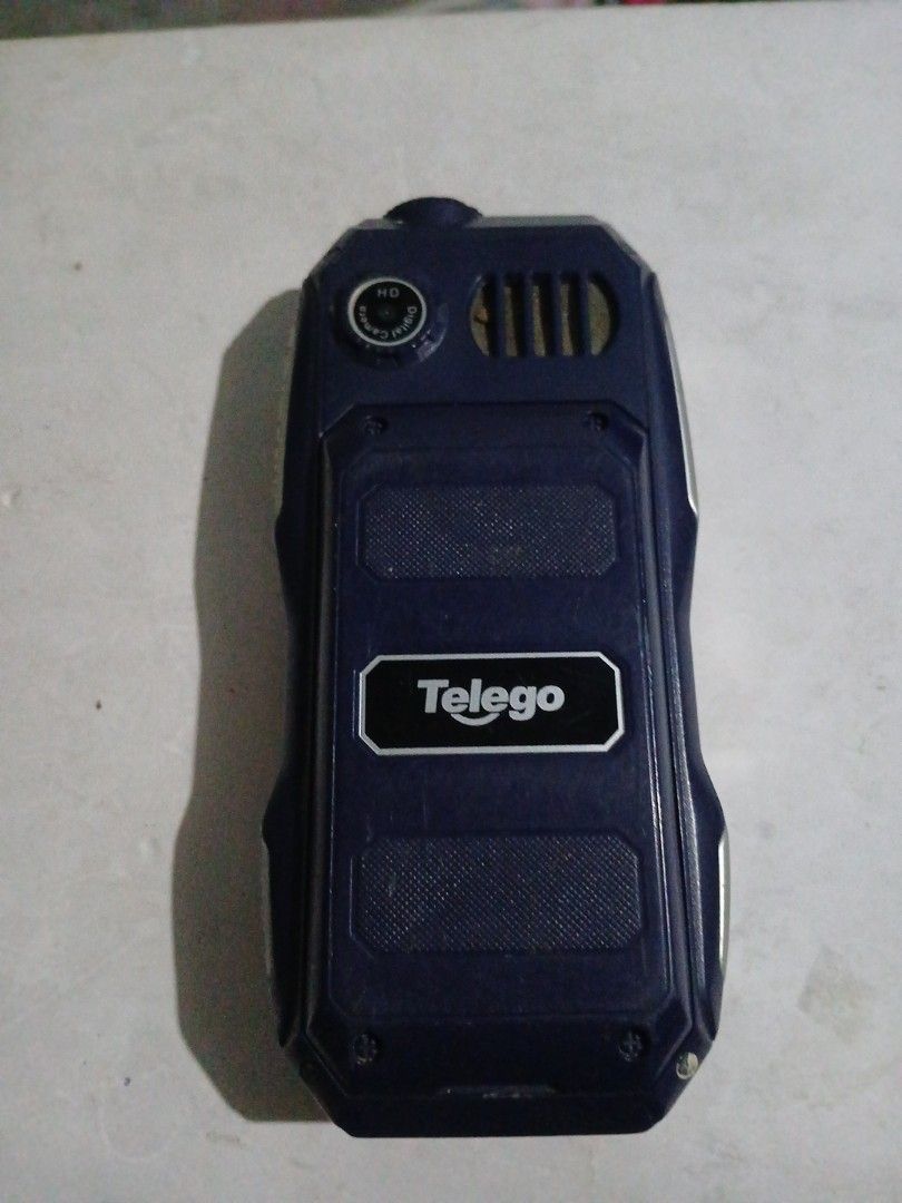 Telego Rugged Phone (Category: Android Others) located in Manila. Submitted by diczenestr94951 (Listing ID 1425161852, Image 2). Description: Rugged Telego phone features a built-in flashlight and a keypad. It has a USB port for charging and data transfer. The phone is dark blue in color..