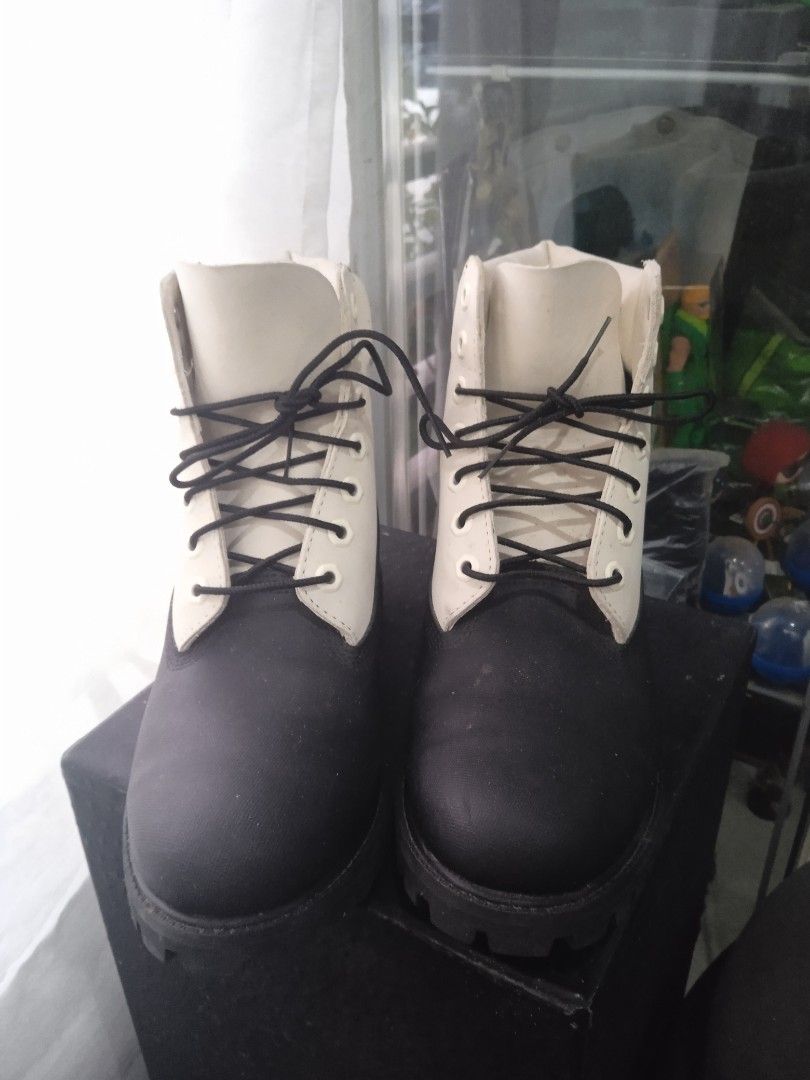 Timberland Black and White Boots (Category: Boots) located in Bacoor. Submitted by jasspapi6 (Listing ID 1425211376, Image 1). Description: Stylish Timberland boots in black and white. Features a classic lace-up design with a durable sole. The boots have a white upper and a black lower section. The Timberland logo is visible on the side. The boots appear to be well-maintained. Negotiable price Payment: Gcash or BDO Shipping: Grab, Lalamove or LBC