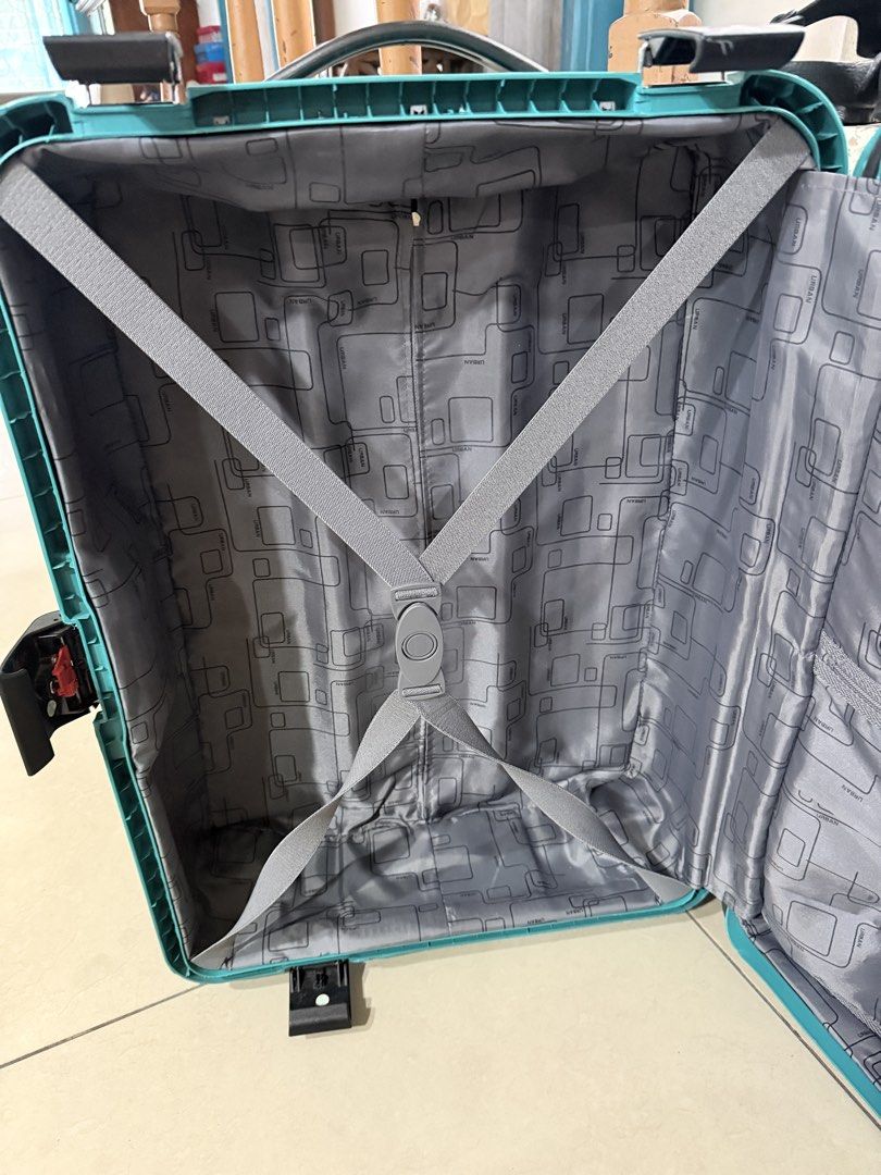 Urban Luggage Teal Suitcase (Category: Luggage) located in San Pablo. Submitted by dtanne (Listing ID 1425194929, Image 3). Description: Teal Urban suitcase with a retractable handle and wheels. The interior features a gray lining with multiple compartments and straps to secure belongings. It has a handle on top and a lock mechanism. The suitcase has the Urban logo on the front..