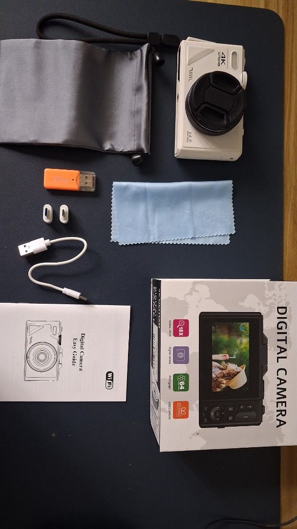 Vetek 8 - 4K Digital Camera (Category: Cameras) located in Angat. Submitted by atkurisushop (Listing ID 1425205850, Image 3). Description: Digital camera features 4K Ultra HD video recording and a zoom lens. It comes with a variety of accessories, including a USB cable, adapters, a cleaning cloth, and a carrying pouch. The camera also includes a user manual. It has a flip-out screen and a variety of shooting modes. RFS: I bought a new phone with 