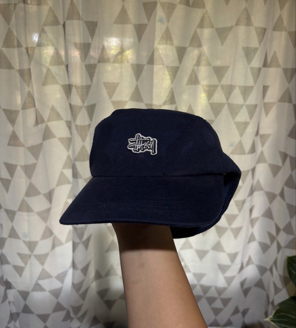 Vintage Stussy Five Panel Closed Cap (Category: Caps & Hats) located in Dipolog. Submitted by krstnagnis98 (Listing ID 1425145557, Image 3). Description: Navy blue cap from Stussy. Features the Stussy logo on the front. The cap has a straight brim and a classic five panel design. A simple and stylish accessory for everyday wear. Vintage Stussy Five Panel Cap Navy Blue Baka may gusto? Fresh from bale 690 add sf Pm..