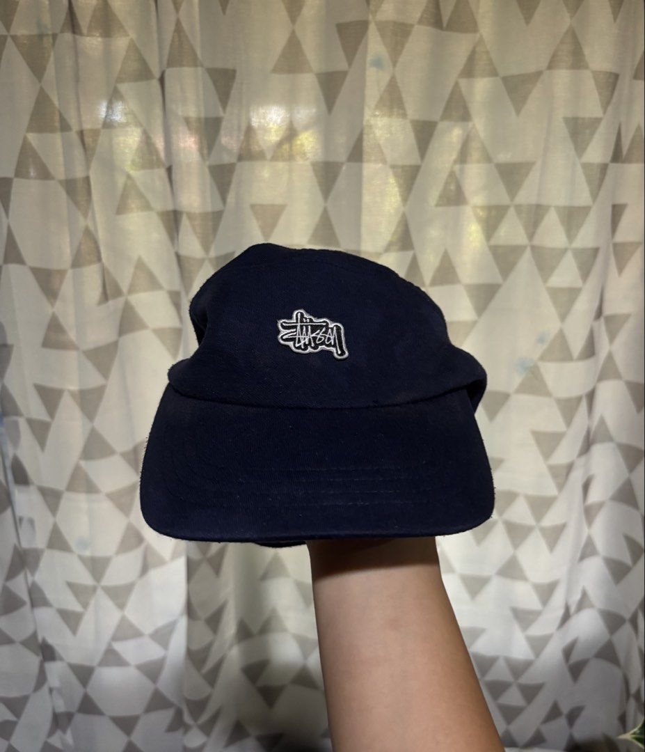 Vintage Stussy Five Panel Closed Cap (Category: Caps & Hats) located in Dipolog. Submitted by krstnagnis98 (Listing ID 1425145557, Image 2). Description: Navy blue cap from Stussy. Features the Stussy logo on the front. The cap has a straight brim and a classic five panel design. A simple and stylish accessory for everyday wear. Vintage Stussy Five Panel Cap Navy Blue Baka may gusto? Fresh from bale 690 add sf Pm..