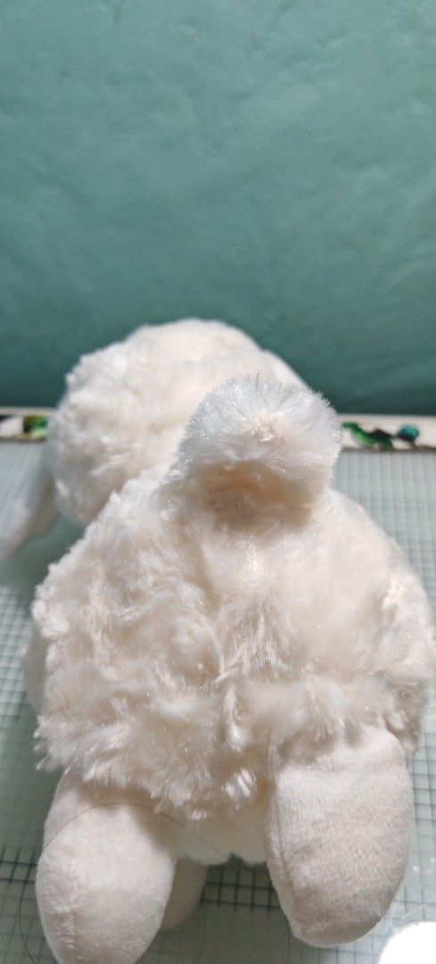White Sheep Stuffed Plush Toy (Category: Plushies & Soft Toys) located in Binan City. Submitted by anime_finds (Listing ID 1425115398, Image 3). Description: Adorable white sheep plush toy. Features a fluffy, soft exterior with a cute face and small ears. The toy has four legs and a small tail. Perfect for cuddling or as a decorative item..