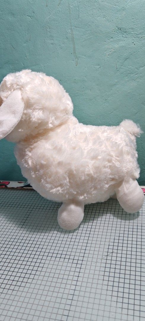 White Sheep Stuffed Plush Toy (Category: Plushies & Soft Toys) located in Binan City. Submitted by anime_finds (Listing ID 1425115398, Image 2). Description: Adorable white sheep plush toy. Features a fluffy, soft exterior with a cute face and small ears. The toy has four legs and a small tail. Perfect for cuddling or as a decorative item..