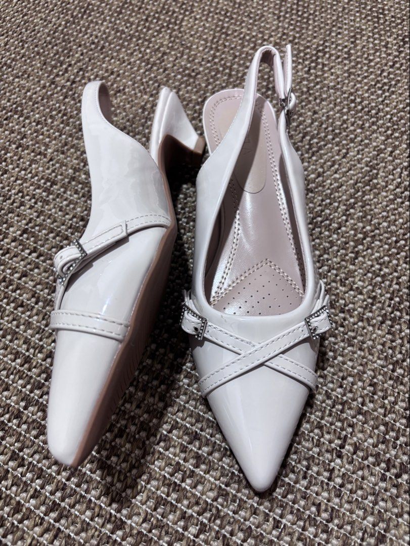White Slingback Heels Size 38 (Category: Heels) located in Caloocan City. Submitted by stuff_shop (Listing ID 1425068303, Image 3). Description: Elegant white slingback heels with pointed toes. Features a small heel and buckle detailing. The size is 38. Perfect for adding a touch of sophistication to any outfit. The heels have a comfortable insole design. Ideal for both casual and semi-formal occasions..