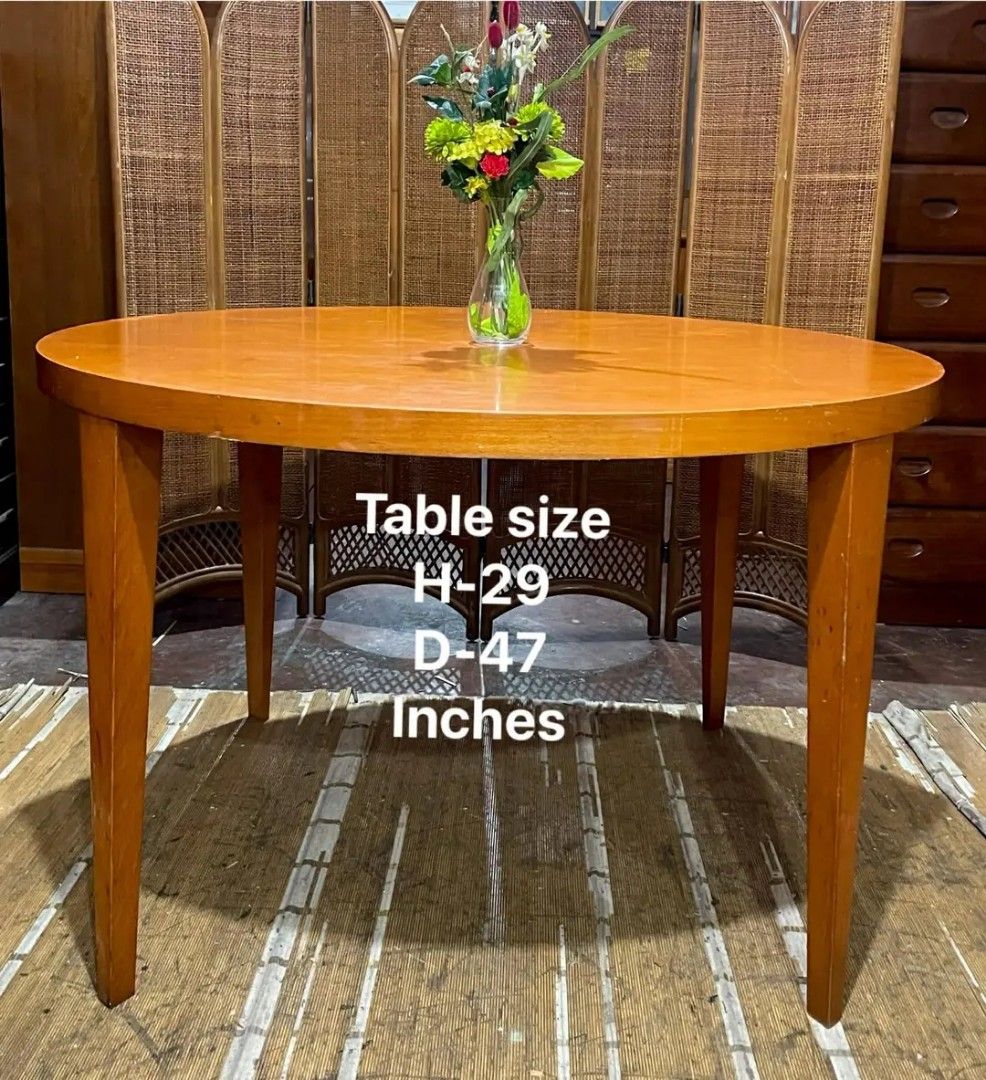 Wooden Dining Table and Chairs Set (Category: Tables & Sets) located in Manila. Submitted by wiseocean.25b393 (Listing ID 1425082314, Image 1). Description: Dining set includes a round wooden table and four chairs. The table is 29 inches high and 47 inches in diameter. The chairs are 18.5/33 inches high, 17 inches long, and 17 inches wide. The set is made of wood and has a warm, natural finish. Perfect for a small dining area or kitchen..