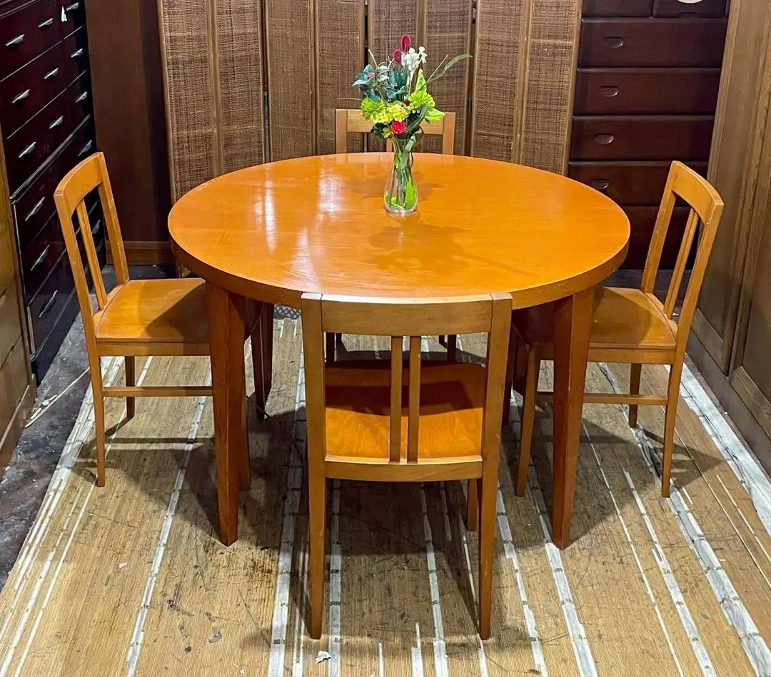 Wooden Dining Table and Chairs Set (Category: Tables & Sets) located in Manila. Submitted by wiseocean.25b393 (Listing ID 1425082314, Image 3). Description: Dining set includes a round wooden table and four chairs. The table is 29 inches high and 47 inches in diameter. The chairs are 18.5/33 inches high, 17 inches long, and 17 inches wide. The set is made of wood and has a warm, natural finish. Perfect for a small dining area or kitchen..
