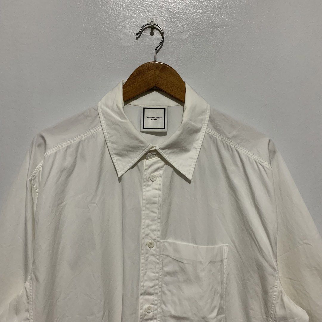 WOOYOUNGMI Paris SS21 Oversized Button Shirt (Category: Formal Shirts) located in Quezon. Submitted by 4301Garms (Listing ID 1425229947, Image 3). Description: WOOYOUNGMI Paris SS21 Oversized Button Shirt Size 52 Width 27.5" Length 29" 9/10 condition Flaws: missing emblem at back part 800.