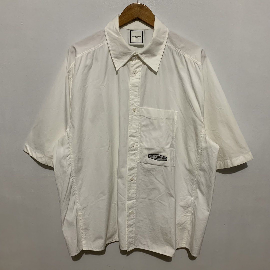 WOOYOUNGMI Paris SS21 Oversized Button Shirt (Category: Formal Shirts) located in Quezon. Submitted by 4301Garms (Listing ID 1425229947, Image 1). Description: WOOYOUNGMI Paris SS21 Oversized Button Shirt Size 52 Width 27.5" Length 29" 9/10 condition Flaws: missing emblem at back part 800.