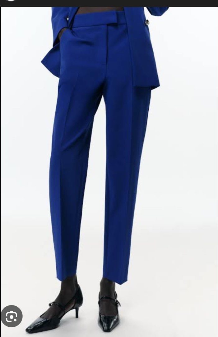 Zara Blue Trousers - Size S (Category: Other Bottoms) located in Quezon City. Submitted by twinklestyle (Listing ID 1425216861, Image 3). Description: Zara blue trousers. Features a tailored design with a straight leg cut. Includes a back pocket and a tag indicating the size is S. The trousers are a vibrant blue color, suitable for various occasions. The style is modern and versatile, perfect for creating a polished look. Brand new with tag Selli