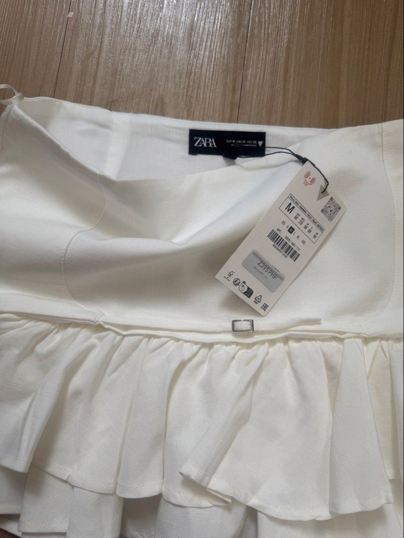 Zara Frilled Mini Skirt - Ecru (M) (Category: Skirts) located in Manila. Submitted by eloi25_ (Listing ID 1425104766, Image 2). Description: - Zara Frilled Mini Skirt - Size: M - Color: Ecru - Brand new with tag - Bought for 2395.