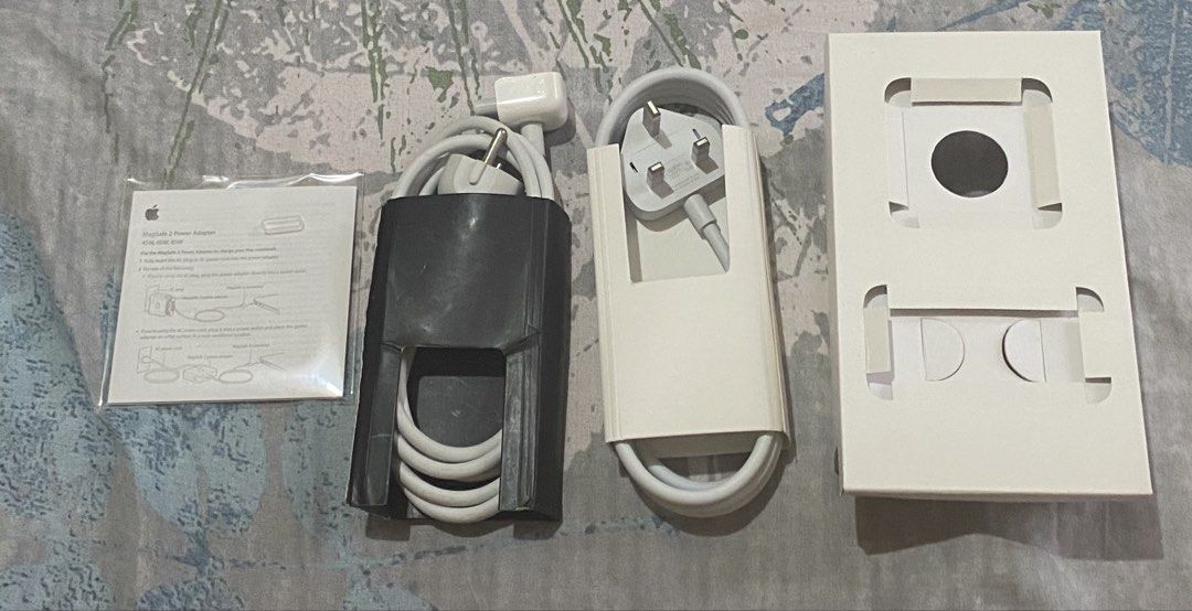 Apple 45W MagSafe 2 Power Adapter (Category: Chargers & Cables) located in Manila. Submitted by decluttered67 (Listing ID 1425272180, Image 3). Description: What’s Included • 45W MagSafe 2 Power Adapter (T-style magnetic connector) • UK 3-Pin Plug Head (standard duckhead) • Power Extension Cable • Original Box & Manuals Compatibility • MacBook Air 11-inch and 13-inch models released between 2012–2017 with a MagSafe 2 port Please Note • Does NOT f