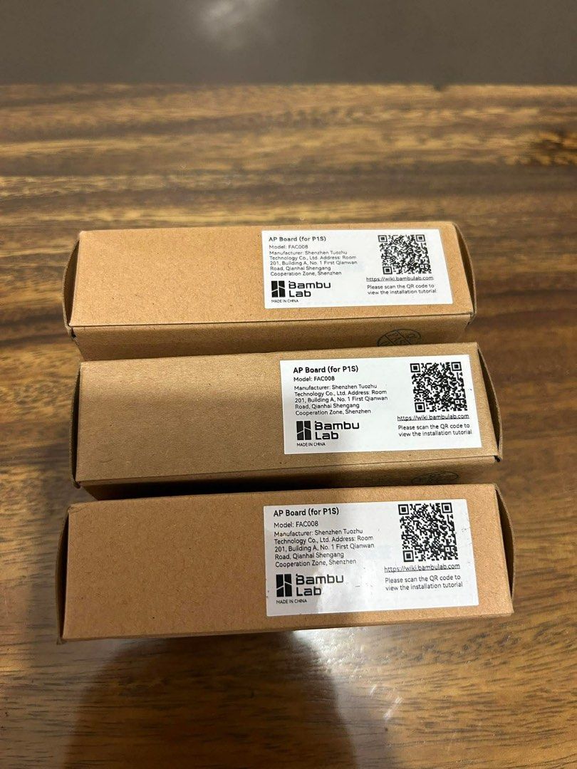 Bambu Lab AP Board (P15) - FAC006 3D printing (Category: Craft Supplies & Tools) located in General Trias. Submitted by charlie.shop (Listing ID 1425280638, Image 2). Description: Listing is for a Bambu Lab AP Board (P15) - FAC006. Each box contains one AP Board. The boxes are brown and have a label with the Bambu Lab logo and product information. The boxes also have a QR code for installation tutorials. 1k each.