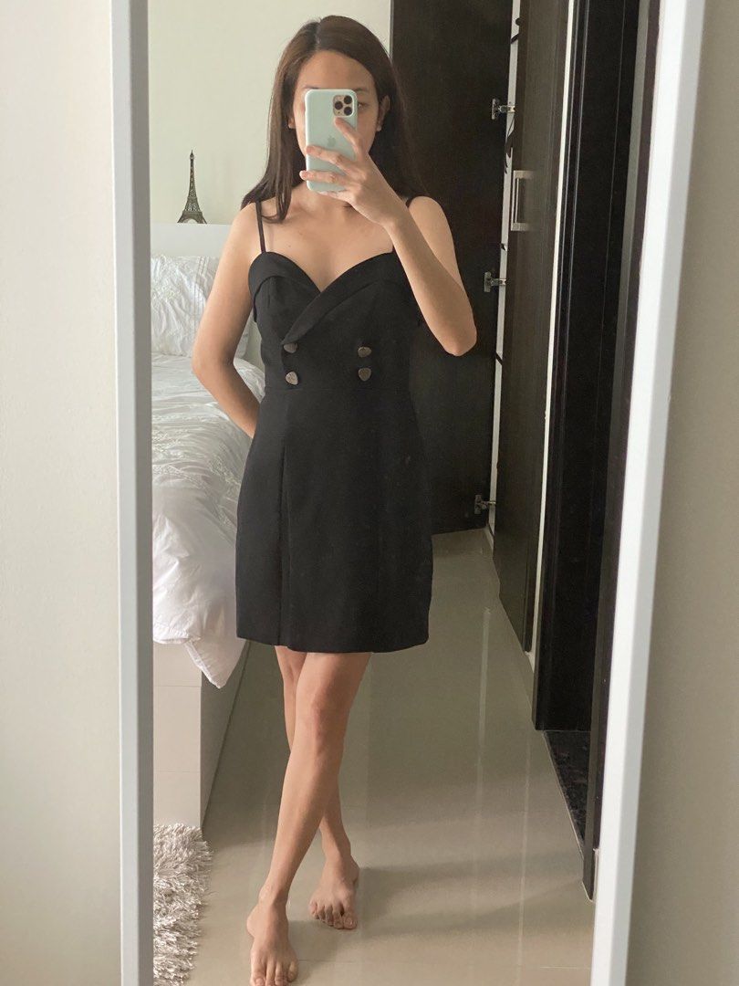 Black Mini Dress with Button Detail (Category: Dresses) located in Santa Cruz. Submitted by beautsbees (Listing ID 1425424437, Image 1). Description: - Topshop Black Mini Dress - Features button detailing - Condition: 4/5 (Good) - Flattering fit - Perfect for various occasions.