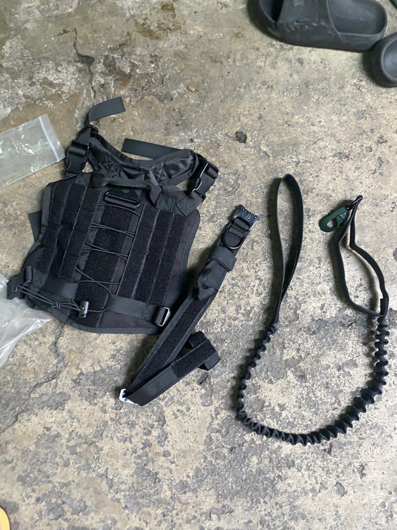 Black Tactical Vest (Category: Vests) located in Caloocan City. Submitted by younghov888 (Listing ID 1421524477, Image 2). Description: - Black tactical vest - Multiple pouches and compartments - Includes extra components - Adjustable straps and buckles - Durable, heavy-duty material.