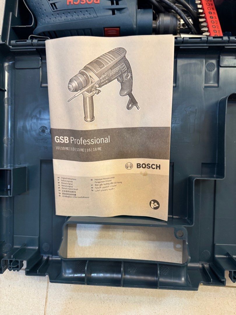 Bosch GSB 10 RE Professional Impact Drill (Category: Construction Tools & Equipment) located in Pasig City. Submitted by lhj0981olx (Listing ID 1425253001, Image 2). Description: • Bosch GSB 10 RE Professional Impact Drill (corded, 500W motor) • Comes with accessory bit set, sturdy case, and original manual. • Compact, lightweight (1.5 kg), forward/reverse, electronic control, LED light. • Fully functional, well-cared for, perfect for DIY or pro 