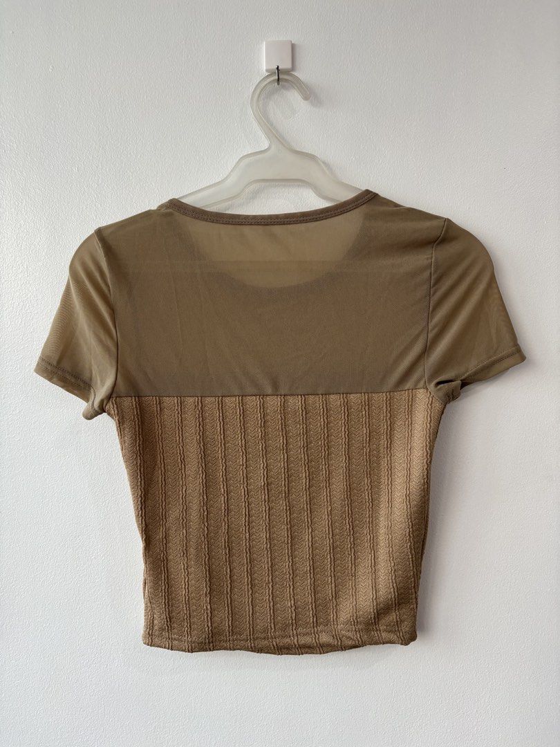 Brown Crop Top (Category: Others Tops) located in Mandaluyong City. Submitted by julsang (Listing ID 1425294219, Image 2). Description: - Brand new 🤎🤍 - slim fit, short sleeve with net yarn patchwork - size: Medium - Crop top - Sheer contrast mesh ruched - Round neck short sleeve slim fit - Highly stretchable.