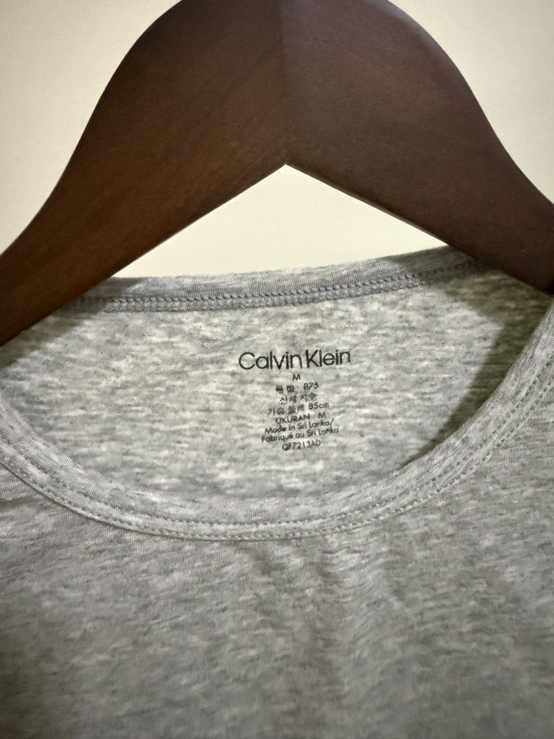 Calvin Klein Bralette Crop Top in Grey Medium (Category: Others Tops) located in Pasig City. Submitted by prelovederis (Listing ID 1425359804, Image 2). Description: Unused w/ small unnoticeable hole (see the photo) factory defect po.