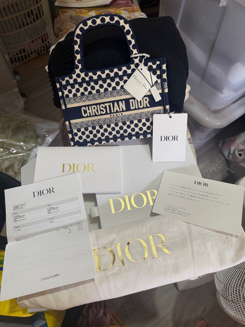 Christian Dior Mini Book Tote Bag (Category: Luxury Bags & Wallets) located in Quezon City. Submitted by jadejoaquin16 (Listing ID 1425296989, Image 1). Description: Christian Dior DiorAmour Book Tote Printed Canvas Mini Blue BRAND NEW COMPLETE .