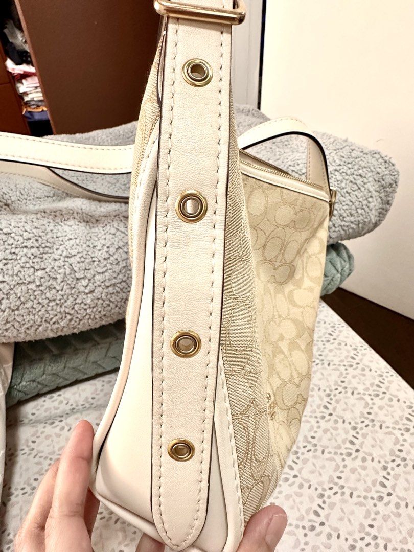 Coach Jacquard Dufflette Bag (Category: Luxury Bags & Wallets) located in Malolos. Submitted by layntev (Listing ID 1425309491, Image 3). Description: Coach - Beige & Cream “Jacquard Dufflette” Bag Stay polished and prepared on-the-go with the Coach “Jacquard Dufflette” Bag. The custom-woven jacquard and smooth leather trim exude luxury, while the gold-tone hardware adds a touch of elegance. The versatile beige and cream color scheme makes this s