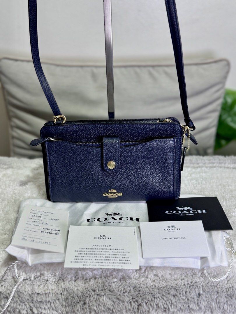 Coach Navy Blue Crossbody Bag (Category: Luxury Bags & Wallets) located in Caloocan City. Submitted by nuoph (Listing ID 1424647663, Image 2). Description: Coach Purchased sa Japan Slightly used SRP 10k+ Selling for only 4,400 FREE acrylic bag case.
