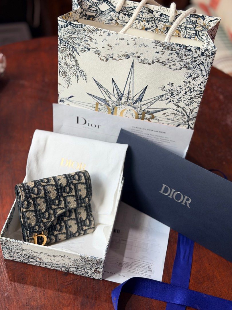 Dior Saddle Lotus Wallet Trifold (Category: Luxury Bags & Wallets) located in Manila. Submitted by declutterwmeh (Listing ID 1425338388, Image 1). Description: Dior Saddle Lotus Wallet Trifold Blue Oblique Jacquard Preloved: Like new condition Barely used Complete box & receipt 25K + S.F (c/o) buyer Firm on price.