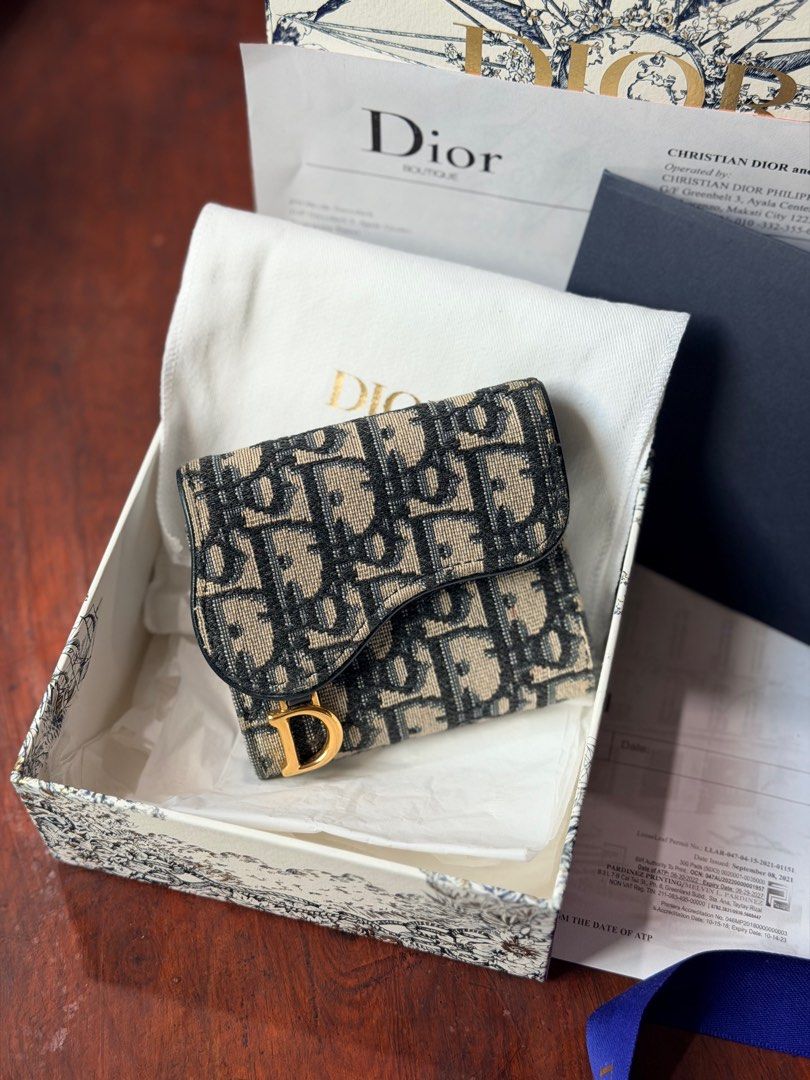Dior Saddle Lotus Wallet Trifold (Category: Luxury Bags & Wallets) located in Manila. Submitted by declutterwmeh (Listing ID 1425338388, Image 2). Description: Dior Saddle Lotus Wallet Trifold Blue Oblique Jacquard Preloved: Like new condition Barely used Complete box & receipt 25K + S.F (c/o) buyer Firm on price.