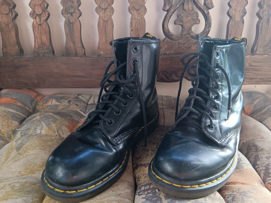 Dr. Martens Black Boots (Category: Boots) located in Manila. Submitted by declutteraf (Listing ID 1425336631, Image 1). Description: Negotiable Classic Dr. Martens boots in black. Features the iconic yellow stitching and air-cushioned sole. The boots have a lace-up design and the Dr. Martens logo is visible on the heel tab. The boots appear to be well-maintained..