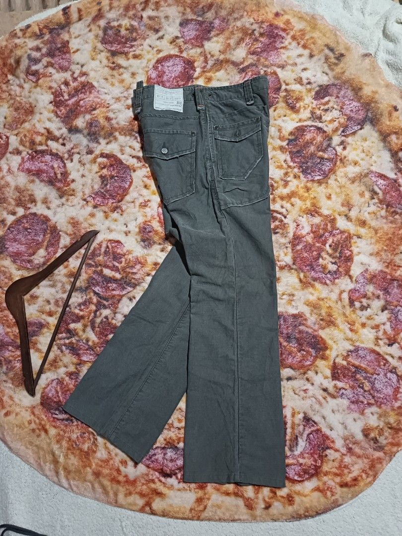 Edwin Utility Trousers - Size M (Category: Trousers) located in Narra. Submitted by davidddyyy (Listing ID 1425250727, Image 3). Description: These Edwin utility trousers feature a classic design with multiple pockets. They have a straight leg fit and are in a muted green color. The trousers include a button and zip closure. The size is M, with a waist measurement of 78 cm and a height of 96 cm. The trousers have a vintage look. -issue:altered he