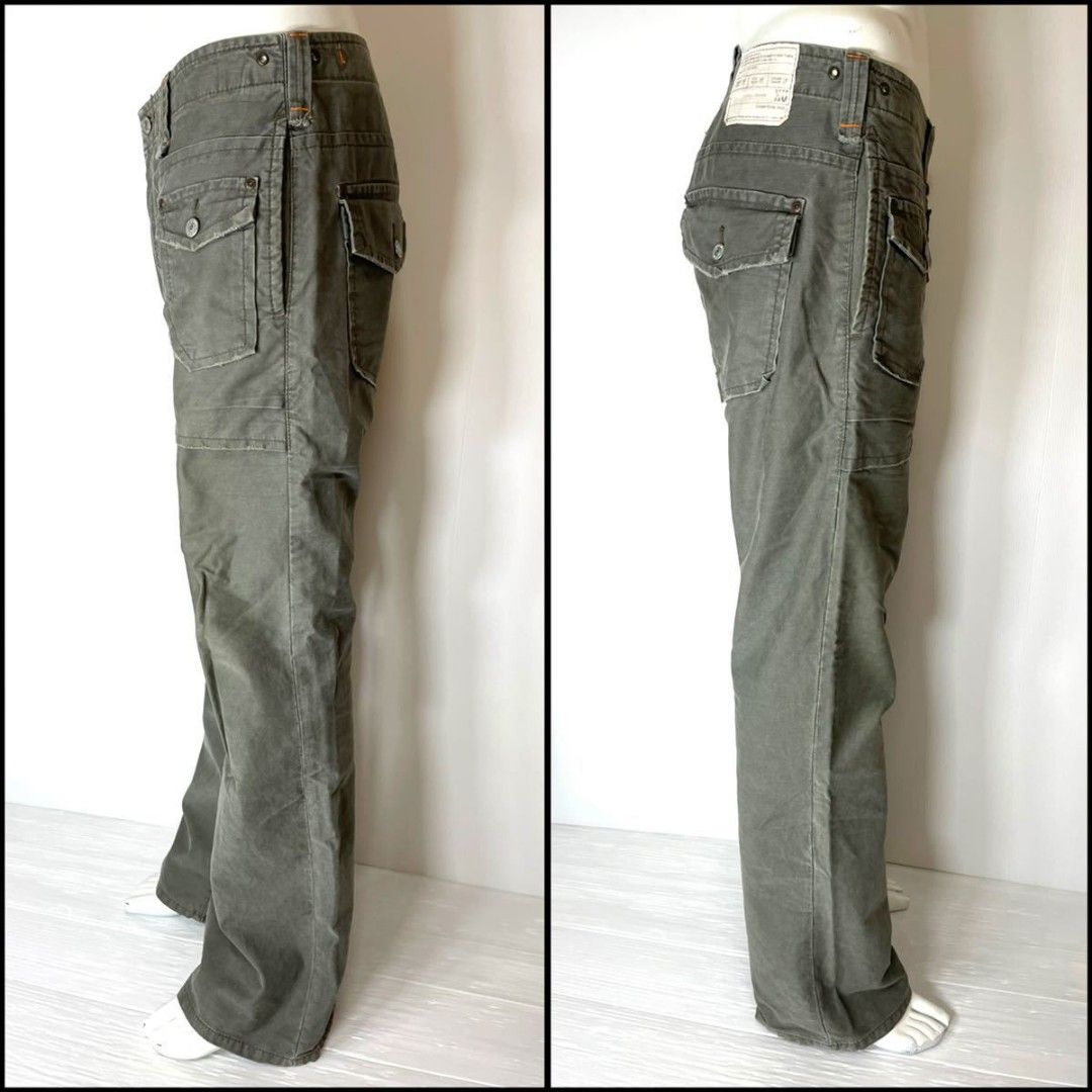 Edwin Utility Trousers - Size M (Category: Trousers) located in Narra. Submitted by davidddyyy (Listing ID 1425250727, Image 1). Description: These Edwin utility trousers feature a classic design with multiple pockets. They have a straight leg fit and are in a muted green color. The trousers include a button and zip closure. The size is M, with a waist measurement of 78 cm and a height of 96 cm. The trousers have a vintage look. -issue:altered he