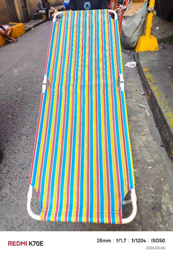 Folding Bed (Category: Bed Frames & Mattresses) located in Manila. Submitted by haideee (Listing ID 1425436905, Image 1). Description: Folding bed is perfect for comfort and convenience. It features a colorful striped design and a foldable frame for easy storage. It's ideal for relaxing or as an extra sleeping space..