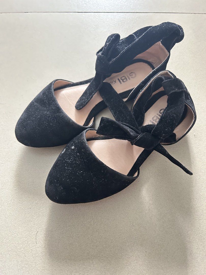 Gibi Kids Black Flats with Ankle Strap Size 25 (Category: Babies & Kids Fashion) located in Quezon City. Submitted by pnmpreloved (Listing ID 1425314517, Image 1). Description: • Worn only x3; good condition; needs cleaning; small scuff on back left heel, but not immediately visible (see photo) • Suede/velvet material • Size 25 • 100% authentic, no available box .