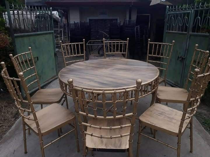 Gold Banquet Chairs and Tables (Category: Tables & Sets) located in Manila. Submitted by warmmoon_b96631 (Listing ID 1425355301, Image 1). Description: Elegant gold banquet chairs and tables, perfect for events and gatherings. Available in round and rectangular table options. Chairs feature a stylish bamboo-like design. Some chairs have cushions. Available in gold and black colors. Ideal for weddings, parties, and other special occasions. Durable
