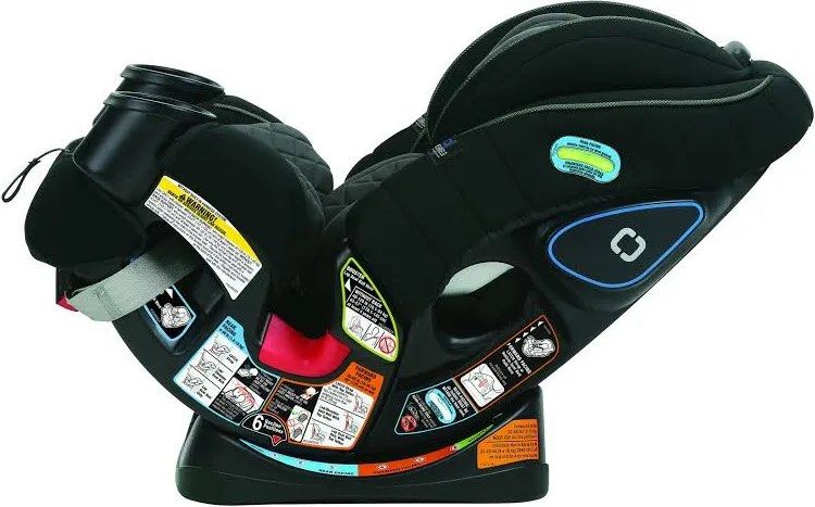 Graco 4Ever Convertible Car Seat (Category: Car Seats) located in Paranaque City. Submitted by samgomez29 (Listing ID 1425327335, Image 1). Description: Graco car seat features a black design with two cup holders. It has multiple safety labels and instructions for forward and rear-facing installation. It has a headrest and side impact protection..