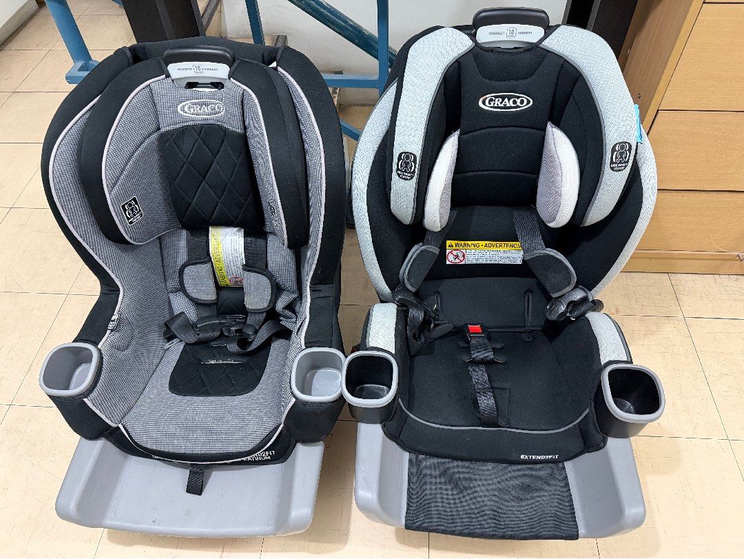 Graco Extend2Fit Platinum Car Seat (Category: Car Seats) located in Mandaluyong City. Submitted by tinamella (Listing ID 1425378852, Image 3). Description: Listing is for a Graco Extend2Fit Platinum car seat. It features two cup holders and adjustable headrest. The seat has a black and gray color scheme. The seat is designed for extended use. The seat has a harness system for securing the child. The seat has a base for easy installation. Used les