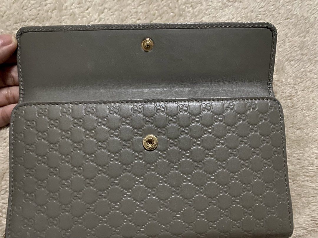 ORIGINAL -Gucci Microguccissima Zip Around Wallet (Category: Luxury Bags & Wallets) located in Manila. Submitted by ina.manila (Listing ID 1425415546, Image 2). Description: - Authentic Gucci wallet - Zip-around closure - Textured microguccissima leather - Neutral gray color - Multiple card slots - Bill compartment - Zippered coin pocket - Interior mirror - Gold-toned hardware - Snap closure.