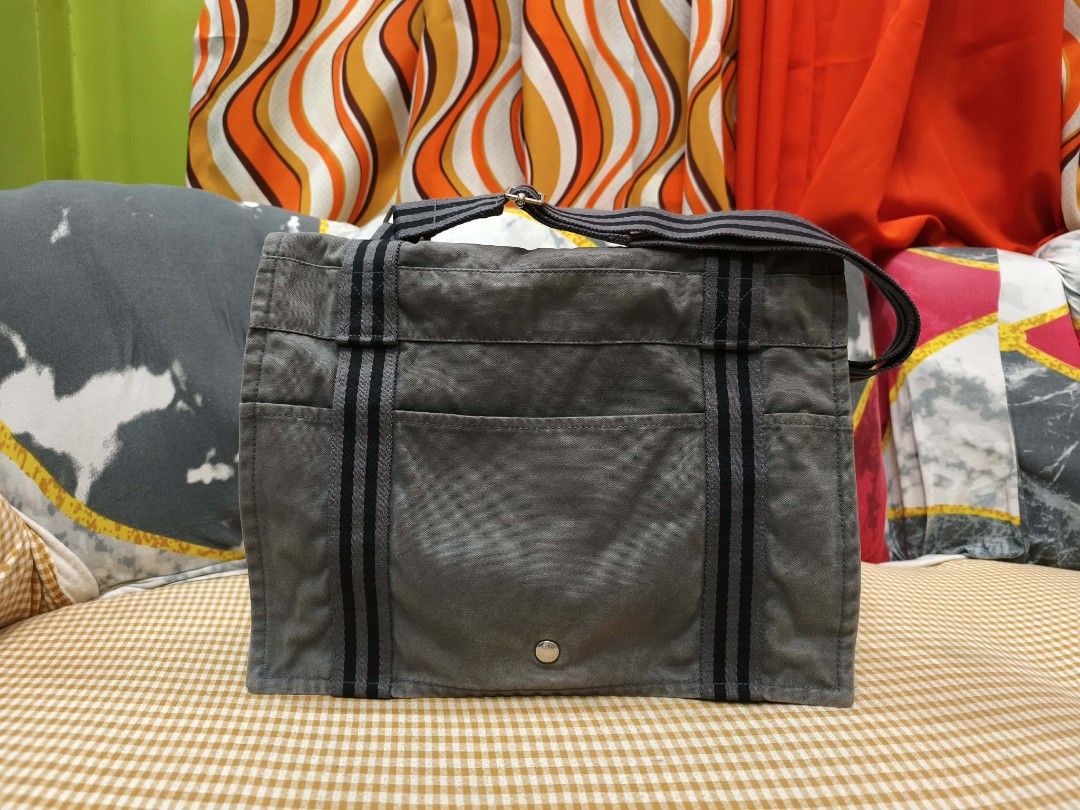 Hermes Herline Fourre-Tout Messenger (Category: Luxury Bags & Wallets) located in Digos. Submitted by emmanuel28 (Listing ID 1425413240, Image 2). Description: Hermes Fourre-Tout Messenger Bag Authntic from Japan Made in France Swiss Riri zipper Flop with metal snap button Hermes engraved metal buttons Multi pockets Color: Gray Measurements: -Width: approx. 12 inches -​Height: approx. 10 inches -​Depth: approx. 2.3 to 3.1 inches -​Strap Drop (Adj
