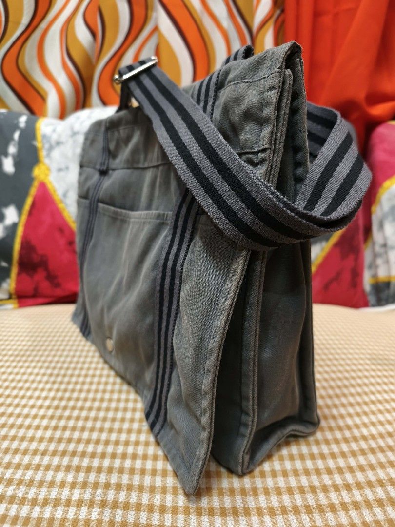 Hermes Herline Fourre-Tout Messenger (Category: Luxury Bags & Wallets) located in Digos. Submitted by emmanuel28 (Listing ID 1425413240, Image 3). Description: Hermes Fourre-Tout Messenger Bag Authntic from Japan Made in France Swiss Riri zipper Flop with metal snap button Hermes engraved metal buttons Multi pockets Color: Gray Measurements: -Width: approx. 12 inches -​Height: approx. 10 inches -​Depth: approx. 2.3 to 3.1 inches -​Strap Drop (Adj