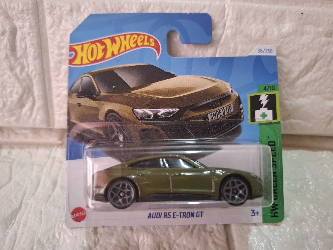 Hot Wheels Audi RS e-tron GT (Category: Vehicle & Diecast Models) located in Narvacan. Submitted by jigger85_2ndaccount (Listing ID 1425254619, Image 1). Description: Hot Wheels Audi RS e-tron GT diecast car. It is part of the HW Green Speed series and is number 4/10. The car is green and features the Audi logo. It is a 1:64 scale model. The packaging includes the Hot Wheels logo and the age recommendation of 3+..