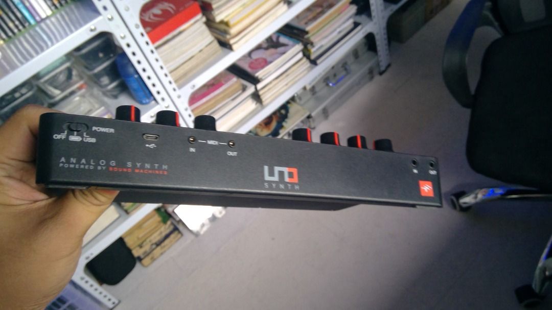 IK Multimedia UNO Synth Analog Synthesizer (Category: Musical Instruments) located in Butuan. Submitted by reggex99 (Listing ID 1425322731, Image 3). Description: IK Multimedia UNO Synth is an analog synthesizer. It features controls for synth, filter, envelope, LFO, and delay. It has a built-in arpeggiator and sequencer. The synthesizer has a USB port, and audio input and output jacks. It is powered by USB or batteries. The unit is black with re